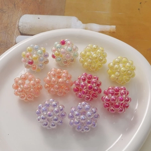 Macro view of colorful woven acrylic hollow spheres for DIY jewelry making and hair accessories