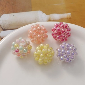 Handmade woven acrylic bead spheres in vibrant colors for DIY jewelry and hair accessories