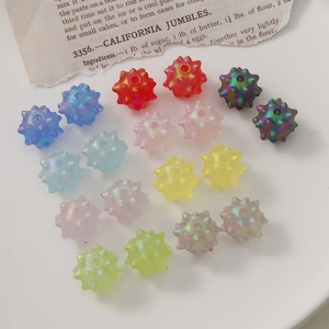 Colorful matte acrylic sea urchin beads for DIY jewelry making displayed on white background