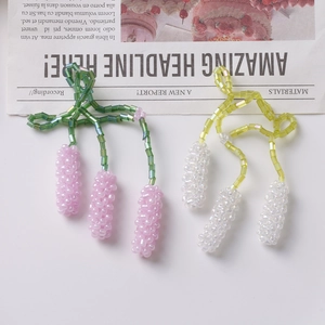 Detailed macro view of handmade lavender floral earrings with woven beads and green stems