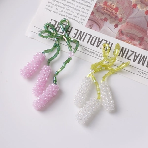 Handmade beaded lavender flower earrings in purple and white with green stems