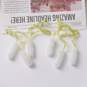 Handmade purple lavender beaded drop earrings featuring yellow square beads and white clusters