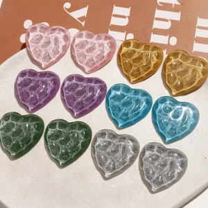 Set of 12 heart-shaped resin charms with water ripple texture in various glitter colors