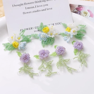 Handmade beaded wisteria flower charms with green leaf tassels for DIY hair accessories
