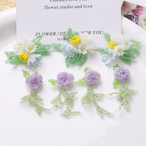 Handmade beaded flower charms with purple roses and white daisies for DIY jewelry