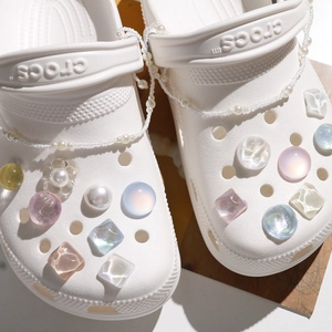 Iridescent crystal shoe charms set with colorful resin gems and pearl chains for clogs