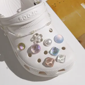 Detail of aurora crystal charms and pearl chain accessories for decorative clogs