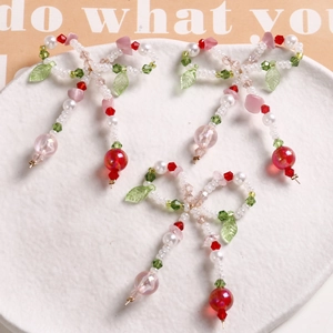 Three handmade beaded butterfly bow charms with pearls and green leaf beads