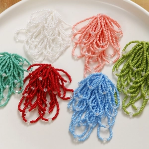 Handmade beaded flower tassel pendants in various colors for DIY jewelry making