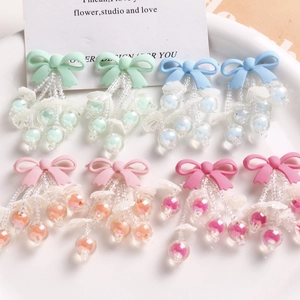 Detailed set of handmade pastel bow bead pendants for DIY jewelry and accessories