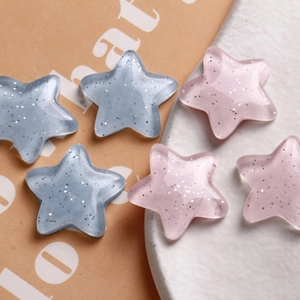 Sparkly macaron resin star charms in pink and blue for DIY jewelry and phone cases