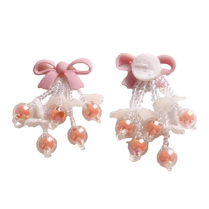Pink bow beaded earrings with transparent tassels and iridescent sphere charms