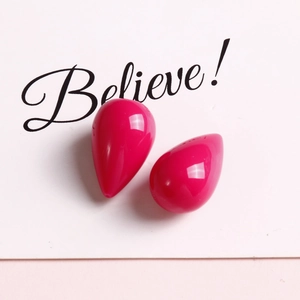 Detailed view of polished fuchsia teardrop beads for elegant DIY jewelry earring making