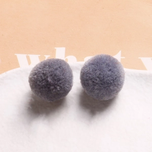 Detail of 20mm grey-purple plush round pompom balls for DIY handmade jewelry crafts