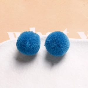 Macro shot of bright blue 20mm plush round balls for handmade DIY jewelry making