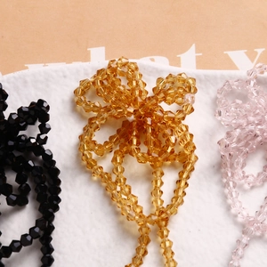 Handmade multifaceted crystal glass bead tassels in amber, black, and pink colors