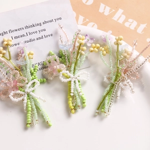 Handmade woven glass bead flower bouquet accessories in pink, purple and yellow colors