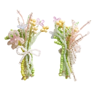 Handmade beaded floral bouquet earrings with glass beads and a white beaded bow