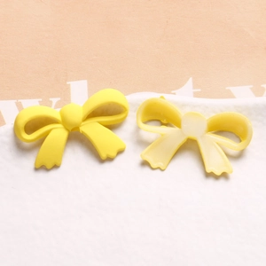 Nœud en résine jaune mat pour bijoux DIY, vue avant et arrière pour loisirs créatifs