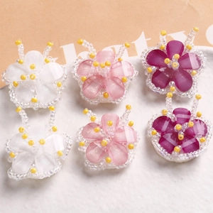Handmade woven five-petal beaded flower accessories in white, pink, and purple colors