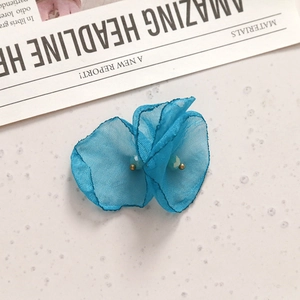 Blue handmade mesh flower accessory with dual-layer fabric and light blue beads