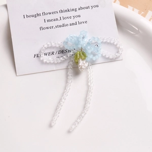 Handmade light blue glass flower and bowknot brooch with elegant beaded tassels