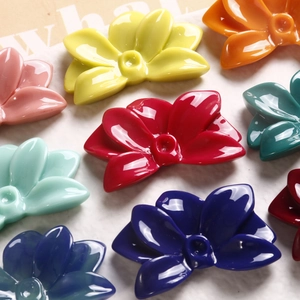 Detailed view of colorful resin flower charms for DIY jewelry and hair accessories