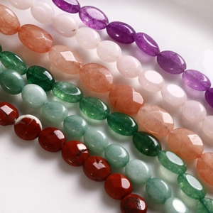 Macro view of polished oval natural stone beads for DIY jewelry in multiple colors