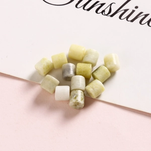 Macro shot of 6mm oval natural stone beads for DIY jewelry making in mixed pastel tones