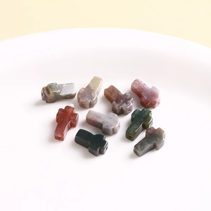 Macro shot of cross-shaped natural stone beads with colorful crackle texture for DIY jewelry