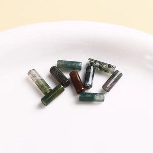 Detailed macro of natural moss agate and carnelian beads for DIY jewelry making