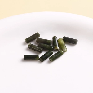 Macro shot of dark green cylinder natural stone beads for DIY jewelry making