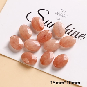 Macro shot of 15x10mm faceted oval pink crystal beads with natural mineral textures