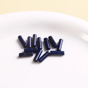 Macro shot of natural lapis lazuli cylindrical beads for DIY jewelry making