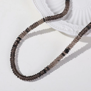 Close-up of 6mm flat round watermelon quartz spacer beads for DIY jewelry making