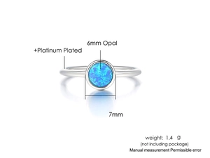 Detail showing 6mm blue opal setting on platinum-plated minimalist silver ring band