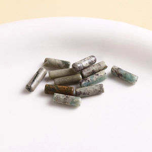 Macro shot of assorted colorful natural stone cylinder beads for DIY jewelry making