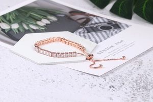 Close-up of rose gold adjustable tennis bracelet with square clear zircon stones