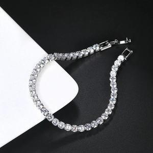 Detailed view of 4mm silver tennis bracelet with round cubic zirconia and folding clasp