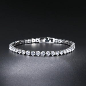 Macro detail of silver tennis bracelet with 4mm round cubic zirconia and safety clasp
