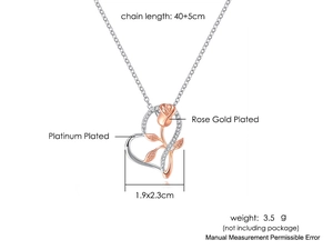 Detailansicht von Herz- und Rosenanhänger mit Platin- und Roségold-Beschichtung und Kristallen