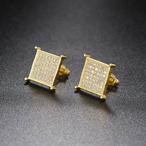 Macro shot of gold square hip hop stud earrings featuring iced-out micro-pave cubic zirconia