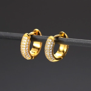 Macro shot of gold-plated hoop earrings with micro-pave cubic zirconia crystals