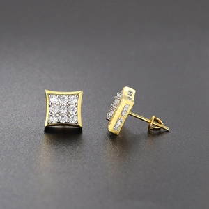 Close-up of hip hop square gold earrings with iced out cubic zirconia and screw-back posts