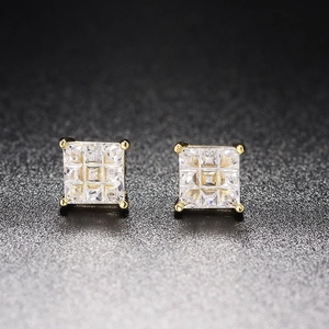 Close-up of square gold-plated earrings featuring a 3x3 grid of clear cubic zirconia stones