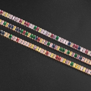 Rainbow rectangle cut zircon tennis bracelets with gold plated claw setting in diagonal view