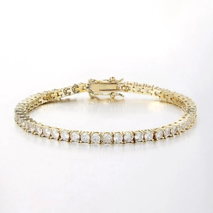 Detail of gold tennis bracelet with cubic zirconia and secure double safety clasp