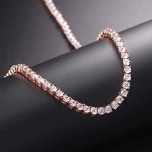 Macro side view of rose gold tennis chain with brilliant cut cubic zirconia on black stand