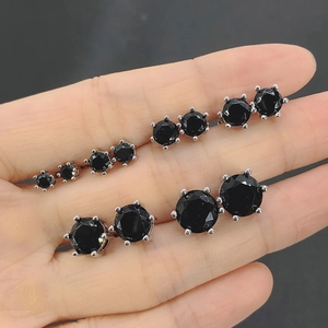 Black round zircon stud earrings in various sizes from 3mm to 8mm on hand
