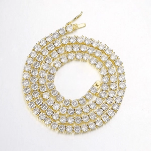 Detail of gold-plated tennis chain with secure clasp and sparkling zircon stones